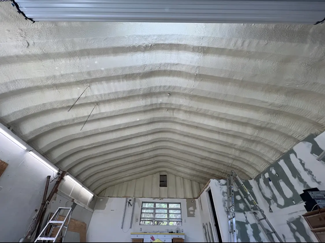 Spray polyurethane foam applied to the underside of a metal roof deck in Richmond